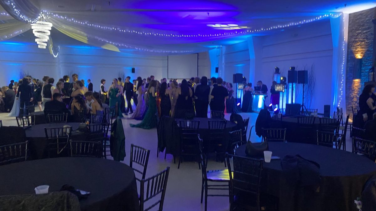 Prom-goers enjoying a full sensory experience on the dance floor.