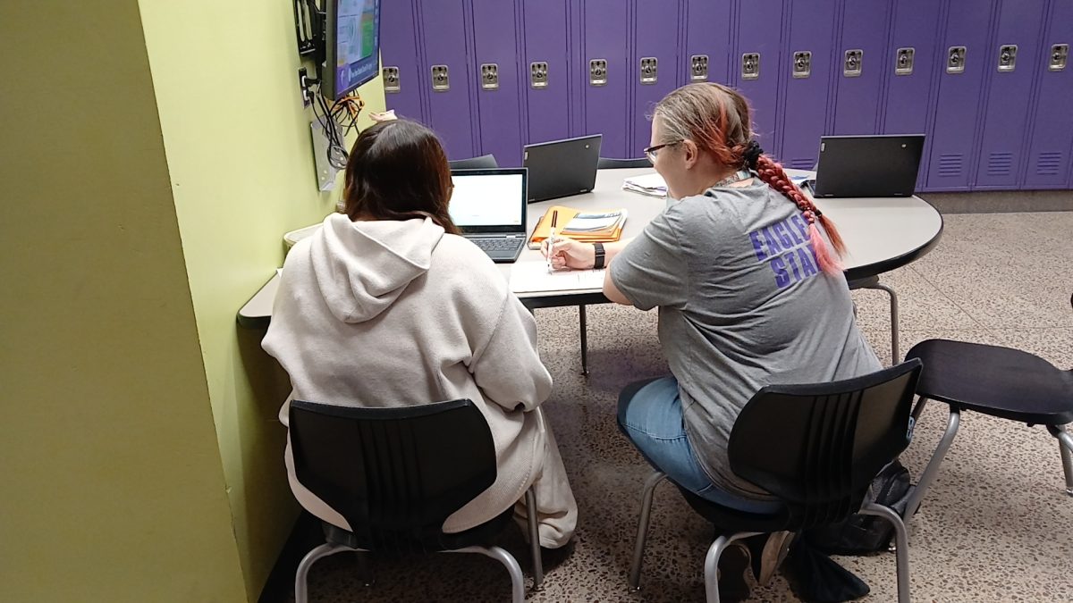 Mrs. Nila helping students succeed in Science 9.