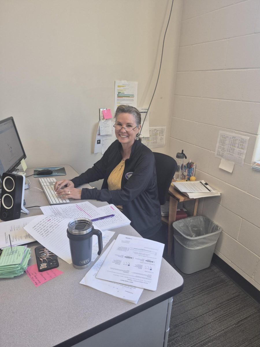 Mrs Cowing at her desk.