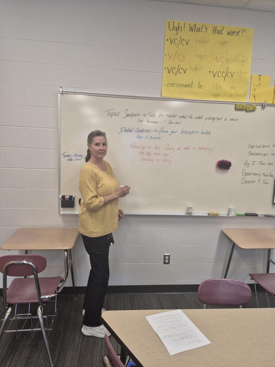 Mrs Cowing at her board