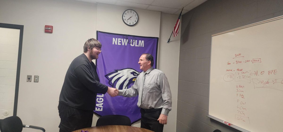 Bergmann talking with student about new classes