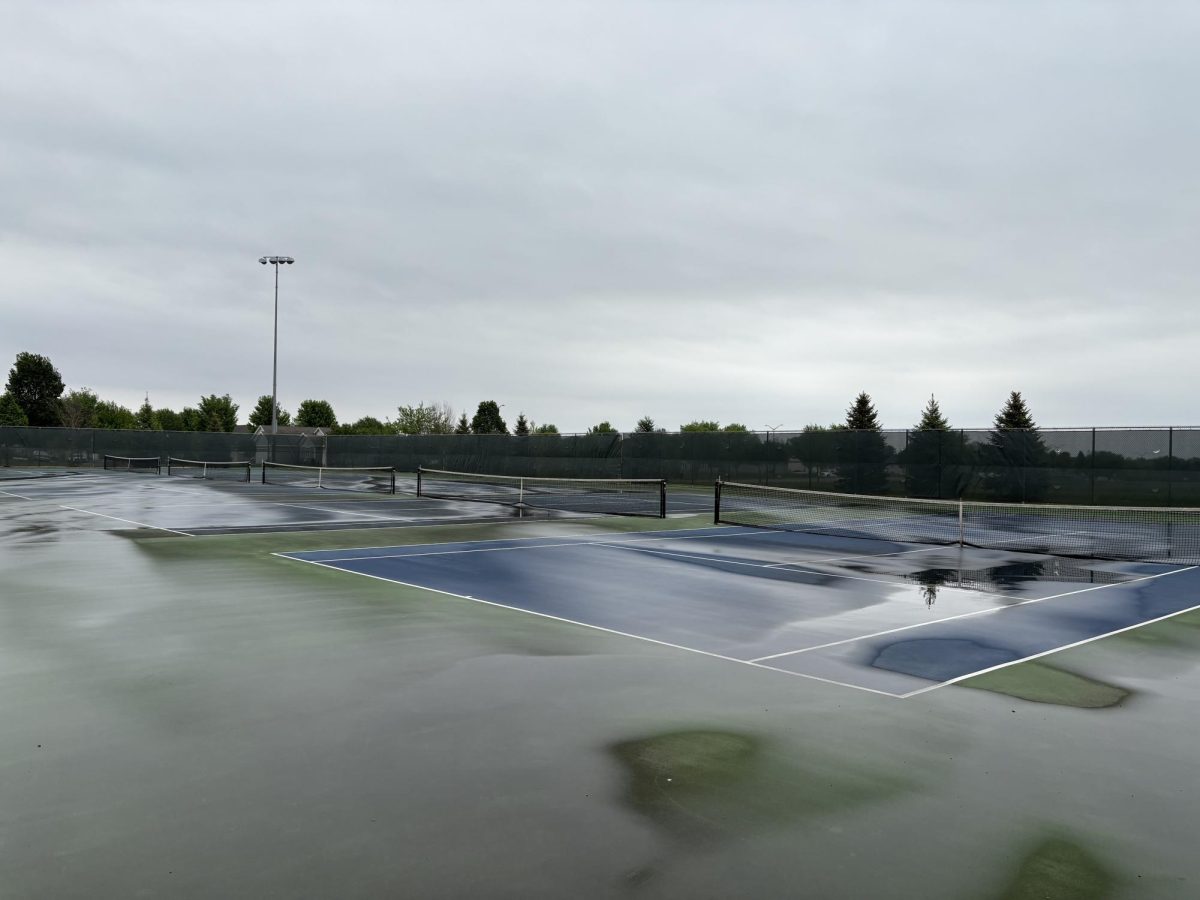 Tennis courts all puddled up.
