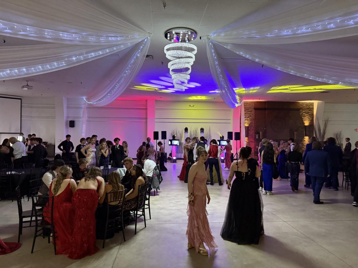 The dance floor is lit up, and people are starting to show up. 