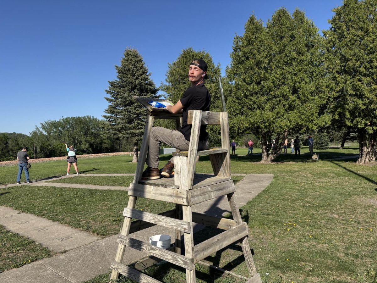 Landon Beck uses scoring chair at trap range