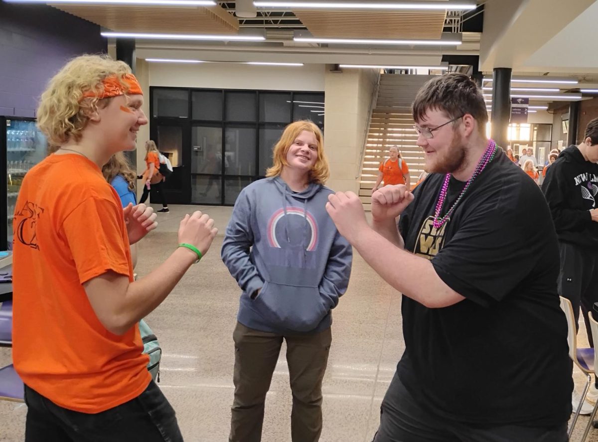 (Left) Freshman Branden Jones and (Right) Senior Levi Ellanson ready for a fight as Freshman Logan Sondag-Bode looks on.
