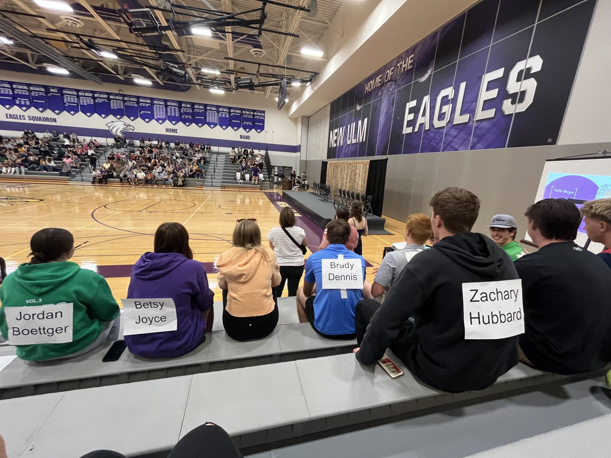 Juniors and seniors sit in their assigned section and get prepared to make the crowd laugh while doing their homecoming court skits 