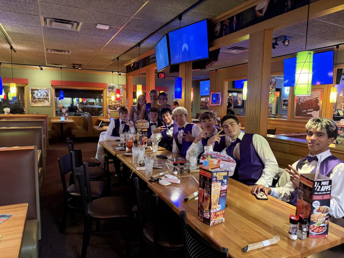 Homecoming court has a celebratory meal after a successful coronation. 