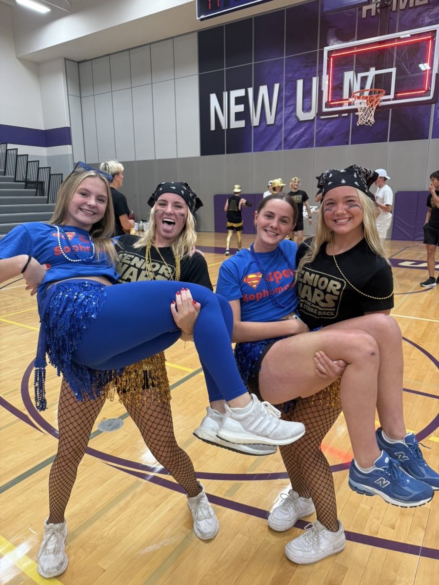Seniors Brooklyn Lewis and Maddi Olson rep black and gold while Sophomores Brecken Wendinger and Zoey Zinns rep blue.