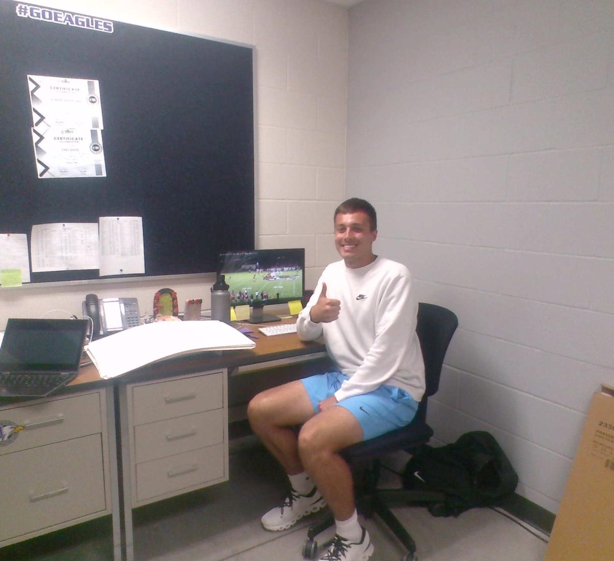 NUHS football coach/ gym teacher Mr. Rodriguez studies previous film