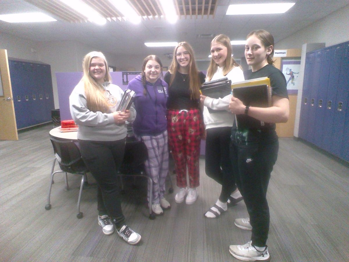 From left to right, Seniors Calleigh Frederickson, Sophie Lund, Bronwyn Schagel, Elizabeth Pearson, and Kelsey Landsteiner dress up for Homecoming week's comfy day.