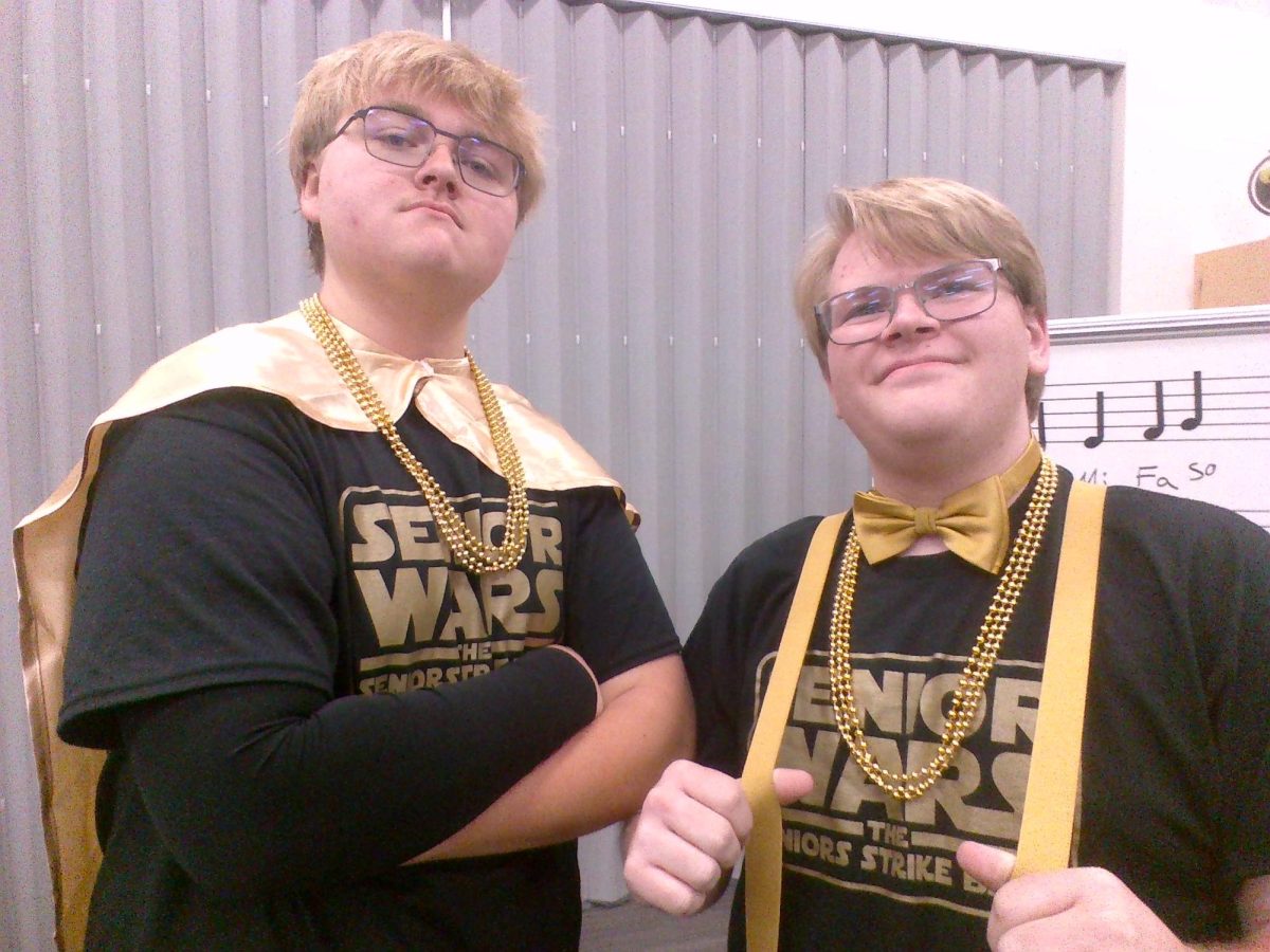 Seniors Everett Brown (left) and Gage Latozke wearing fancy outfits for BOTC