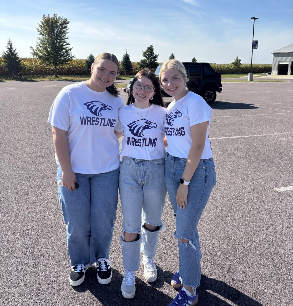 Wrestling manangers (left to right) Addy Wieland, Kate Schmidt, and Aubree Schmidt twin on twin day