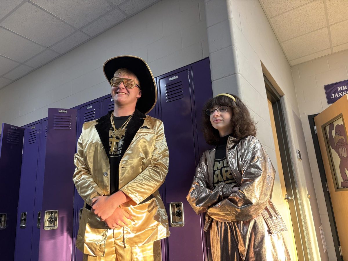 Seniors Hunter Dauer and Ashtynn Schaefer wearing the Senior class colors, gold and black for battle of the classes during homecoming. 