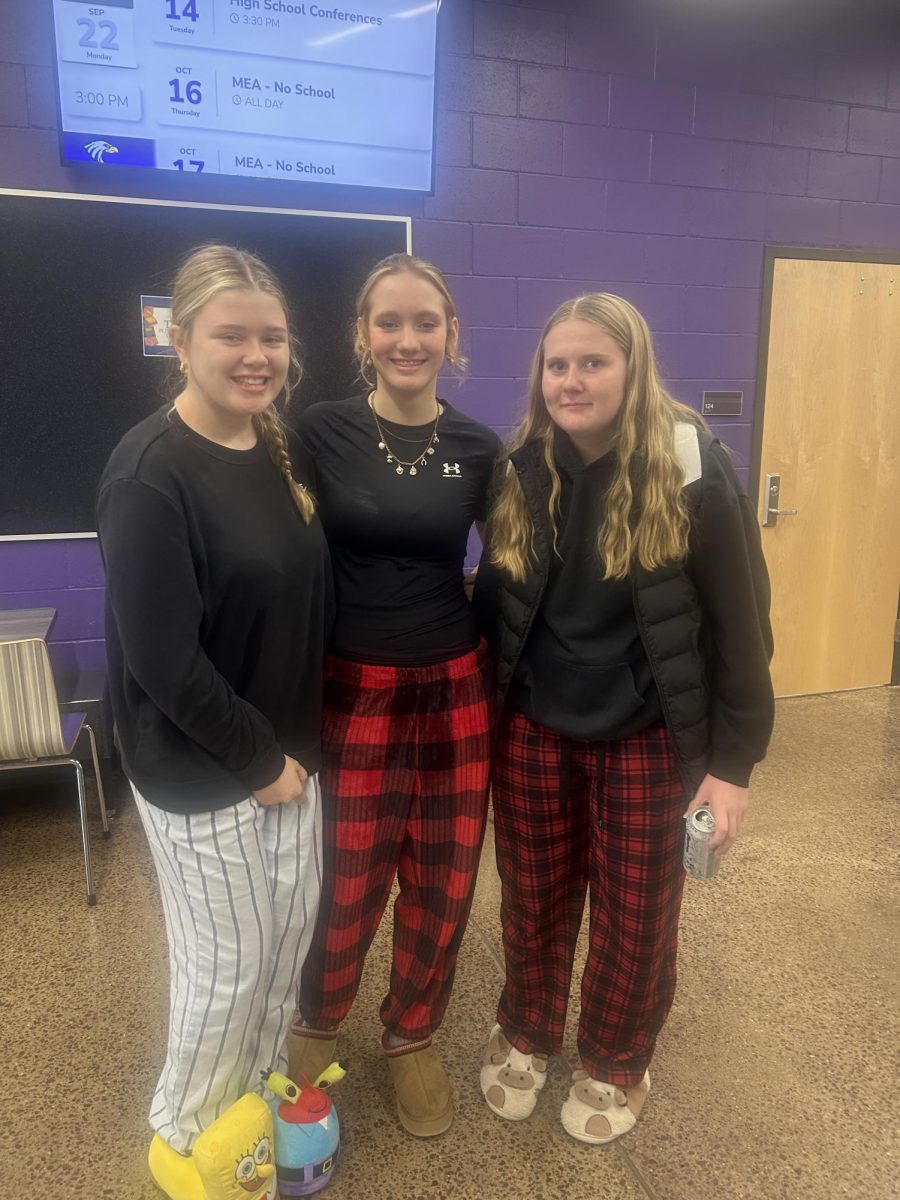 Freshmen Braelynn Schneider, Catherine Simonsen, and Brooklyn Anderson are dressed in pajama pants for comfy day.