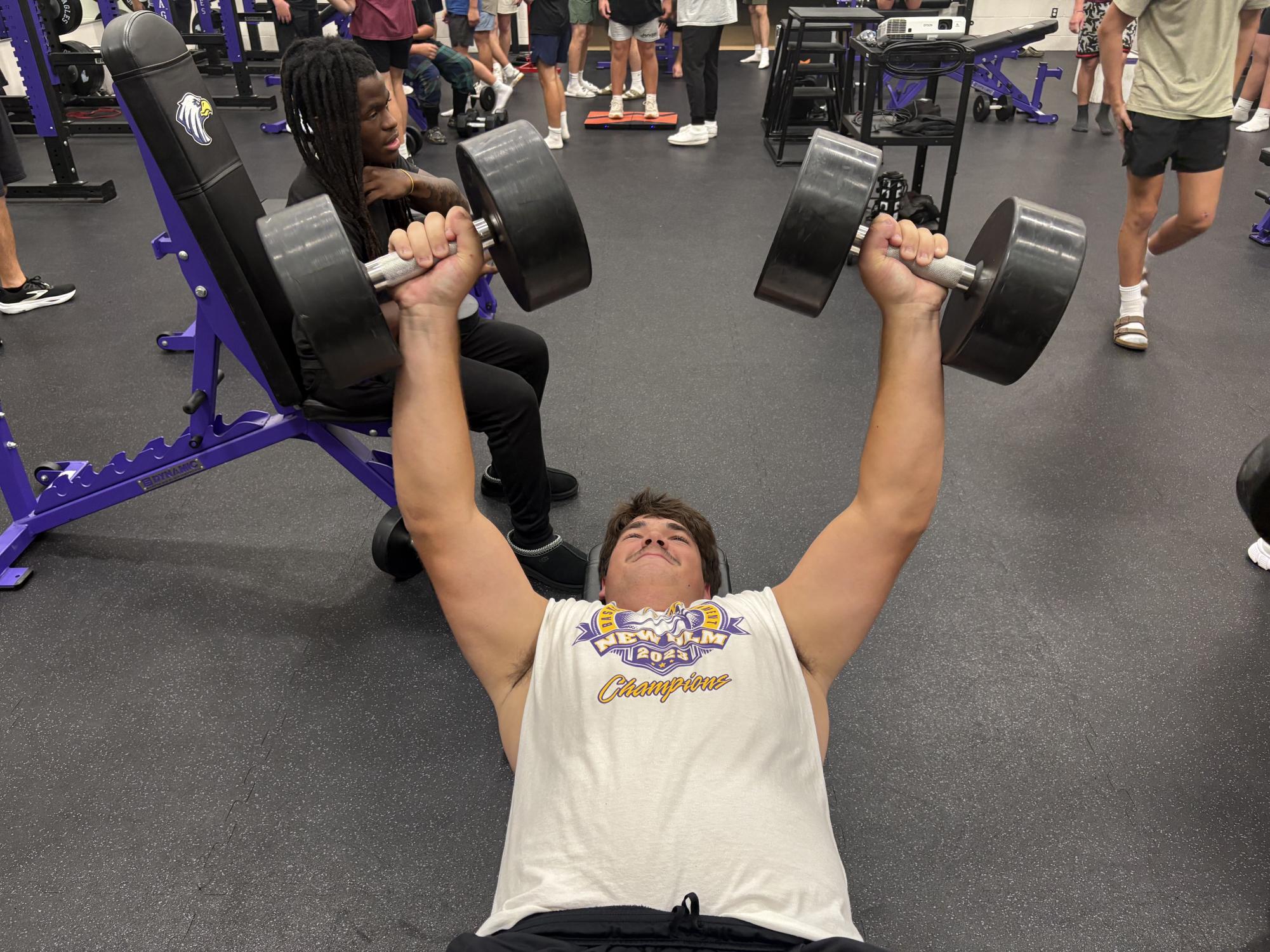 Junior Tanner Backer lifting during a practice