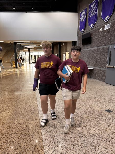 Left: Junior Riley Hacker, Right: Junior Christian Arndt in matching bulldogs shirts on Twin Day