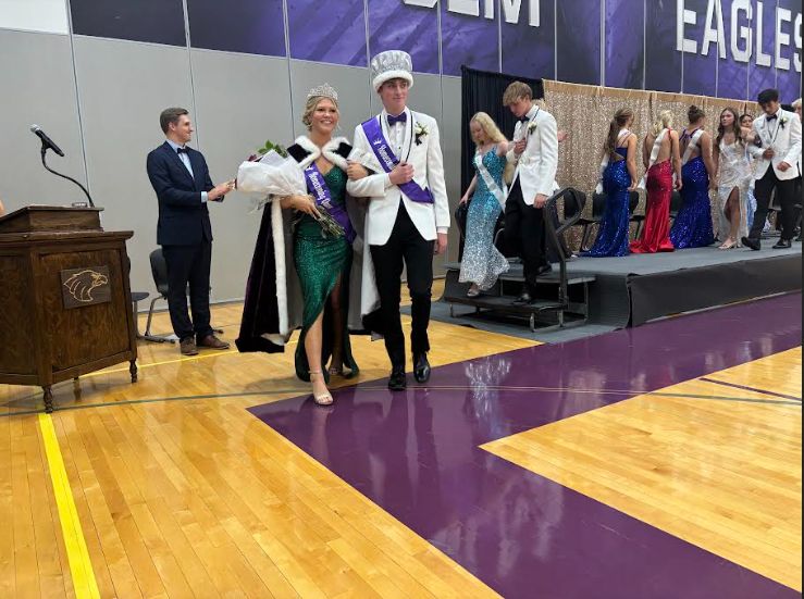 New Coronation Royalty Lauren Schmiesing and Daniel Brownfield make their way around the gym 