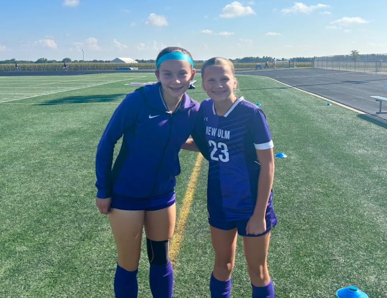 Morgan Zimanski (L) and Josie Nelson (R) get fired up before their soccer game.