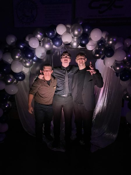 (Left to right) Junior Landon Bohline and Seniors, Tyson Goold and Jevin Zamzow group up for a final homecoming meet up. Bohline said, "This is my first time dressing up like this in 5 years," and the others laugh. 