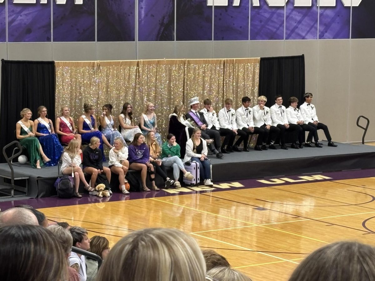 The Homecoming Court gets excited to see who gets the king and queen. 