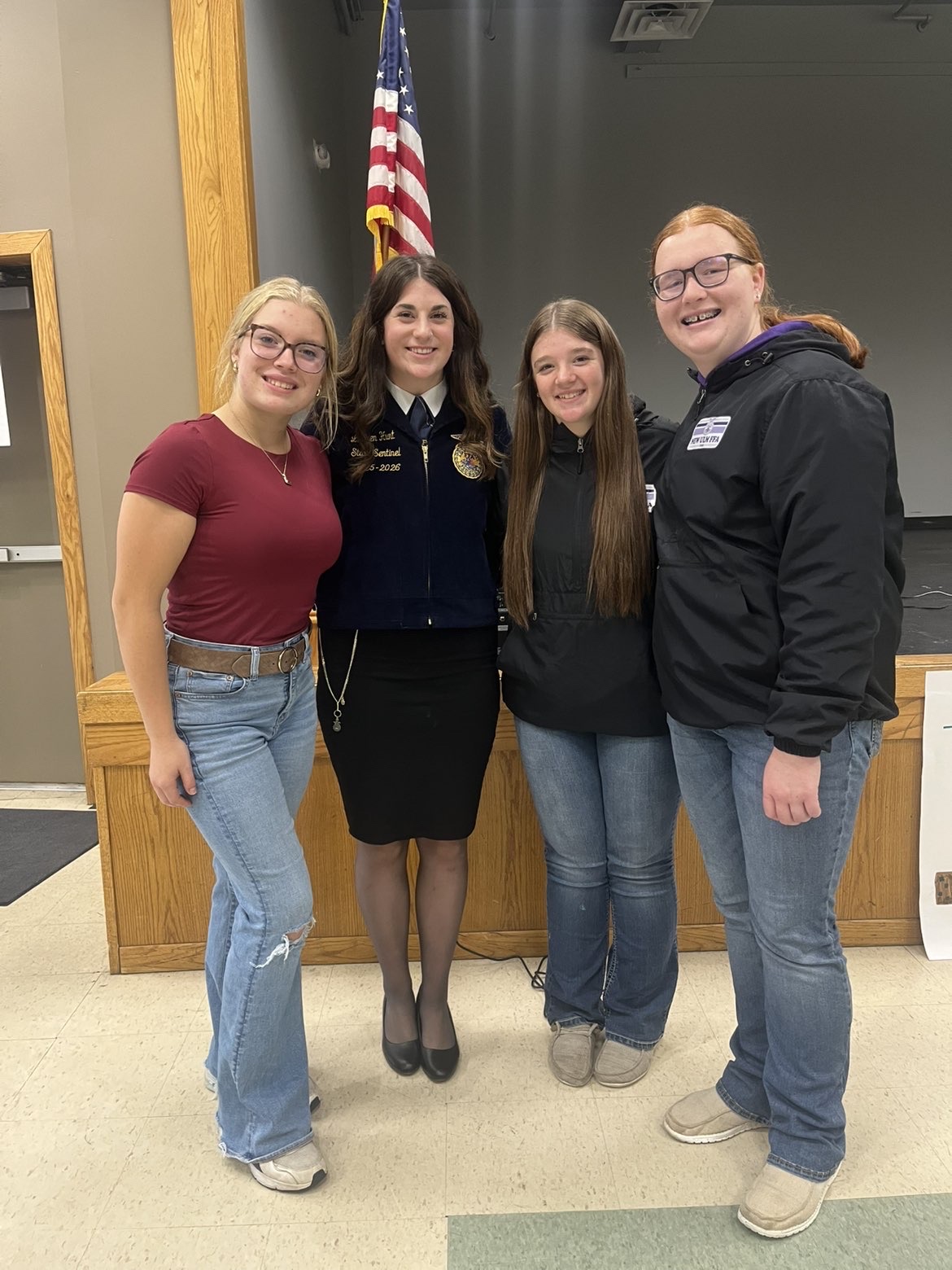 FFA members Abby Willaert, Natalia Frederickson, and Lilly Kral (R to L) pose with state sentinel Lauren Hunt at Fall Leadership Day
