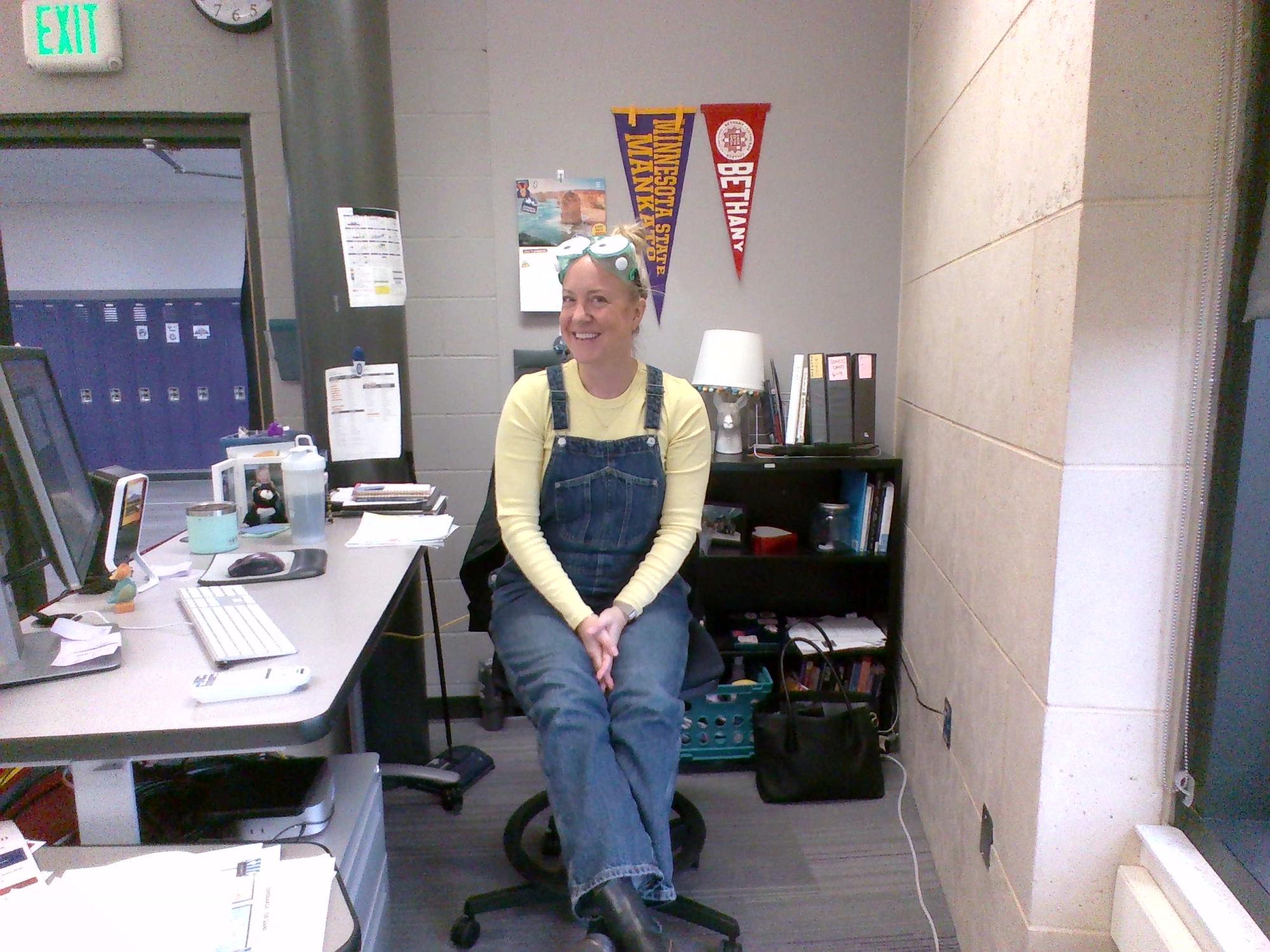 Mrs. Gunderson ready to steal the moon on Halloween. 