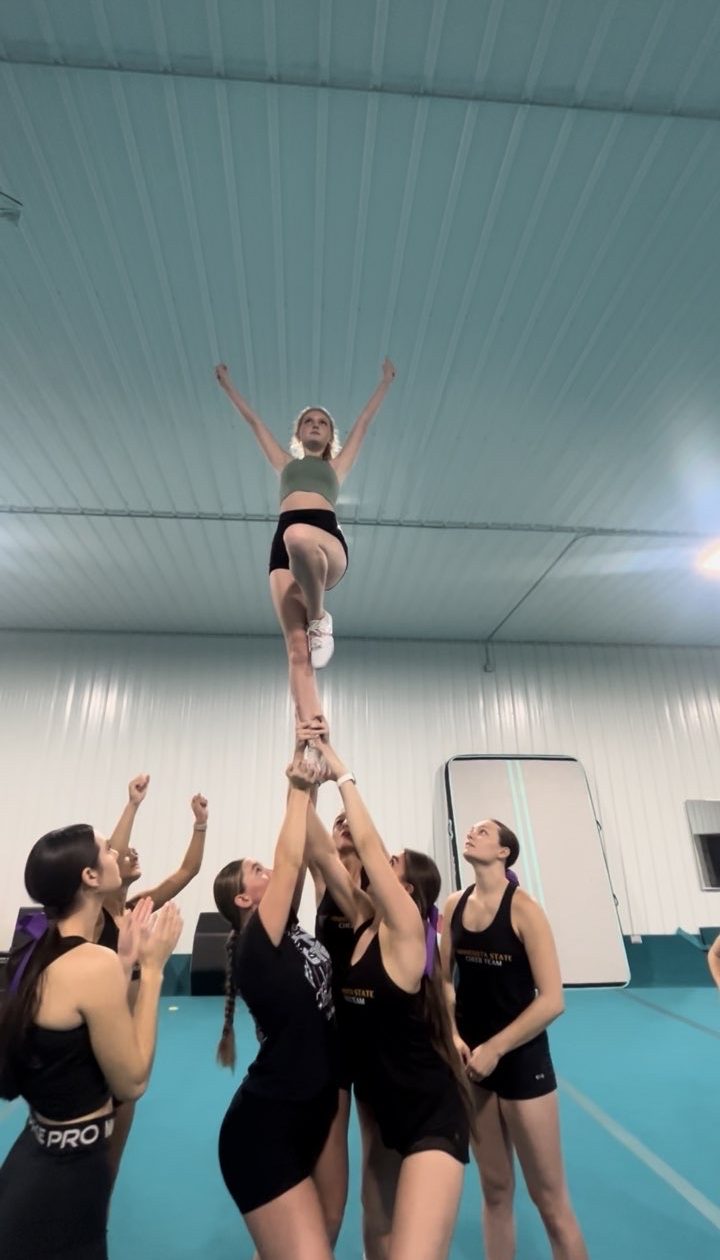 Junior Keelie Dietz performing a Liberty extension stunt.
