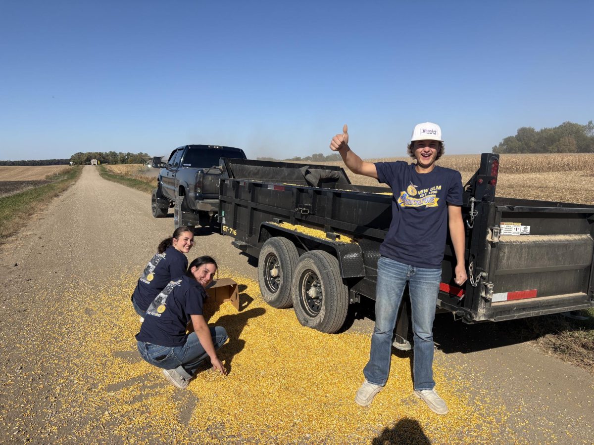 FFA members picking up corn after spill