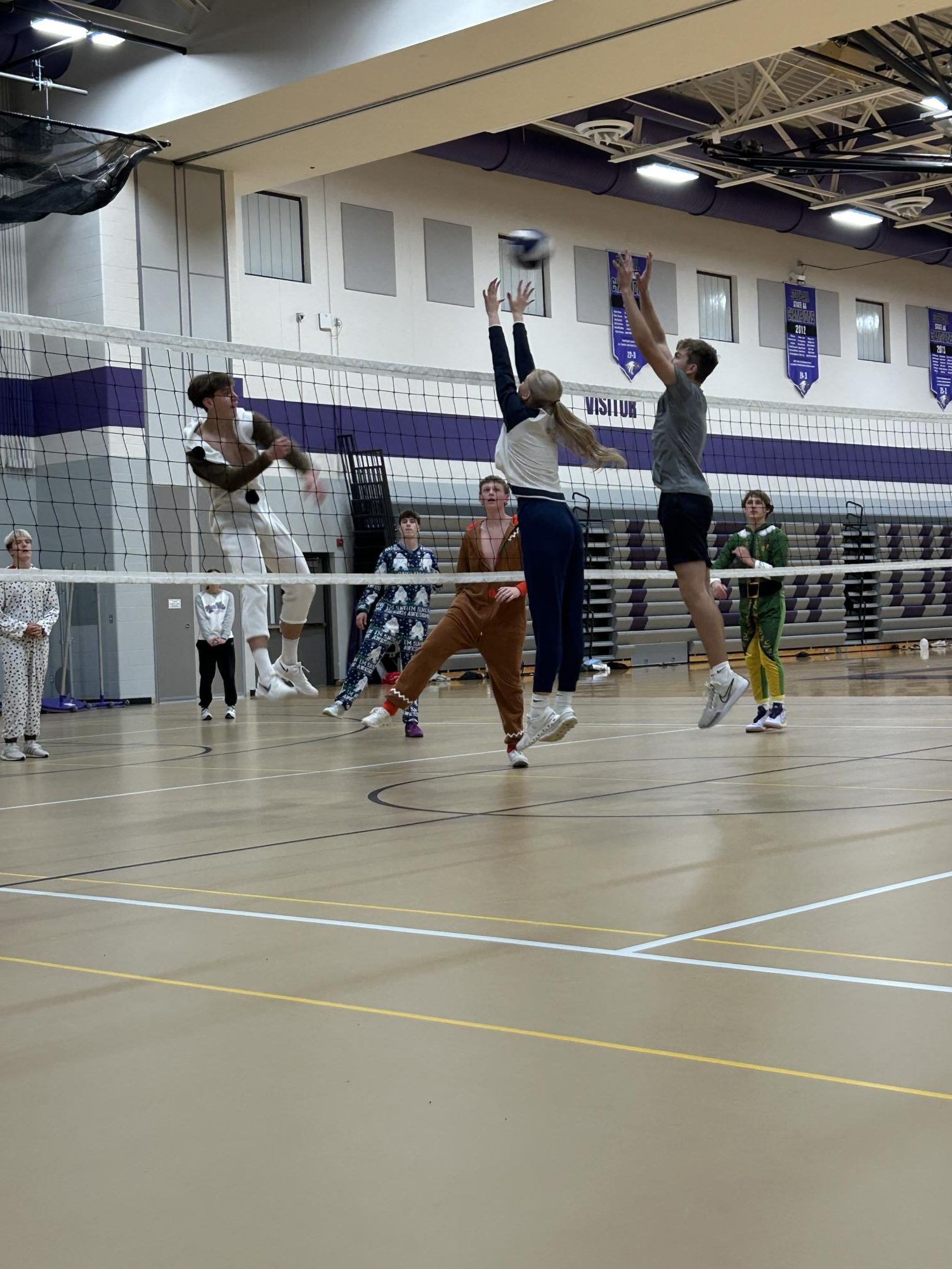 Senior Ryan Rathman and Junior Genesis Rabe jump up to block a kill sent from Junior Mitchell Hopp