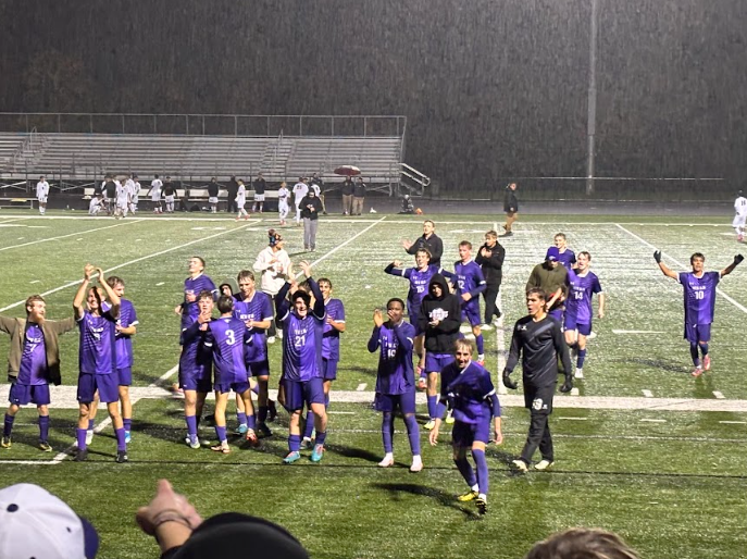 Boys soccer team thanks fans and celebrates after their 2-1 win at the section championship.