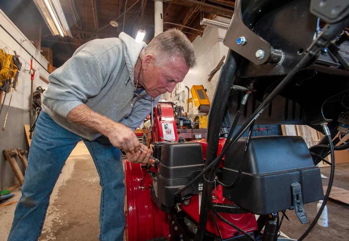 Man fixing snowblower at the CTE Center