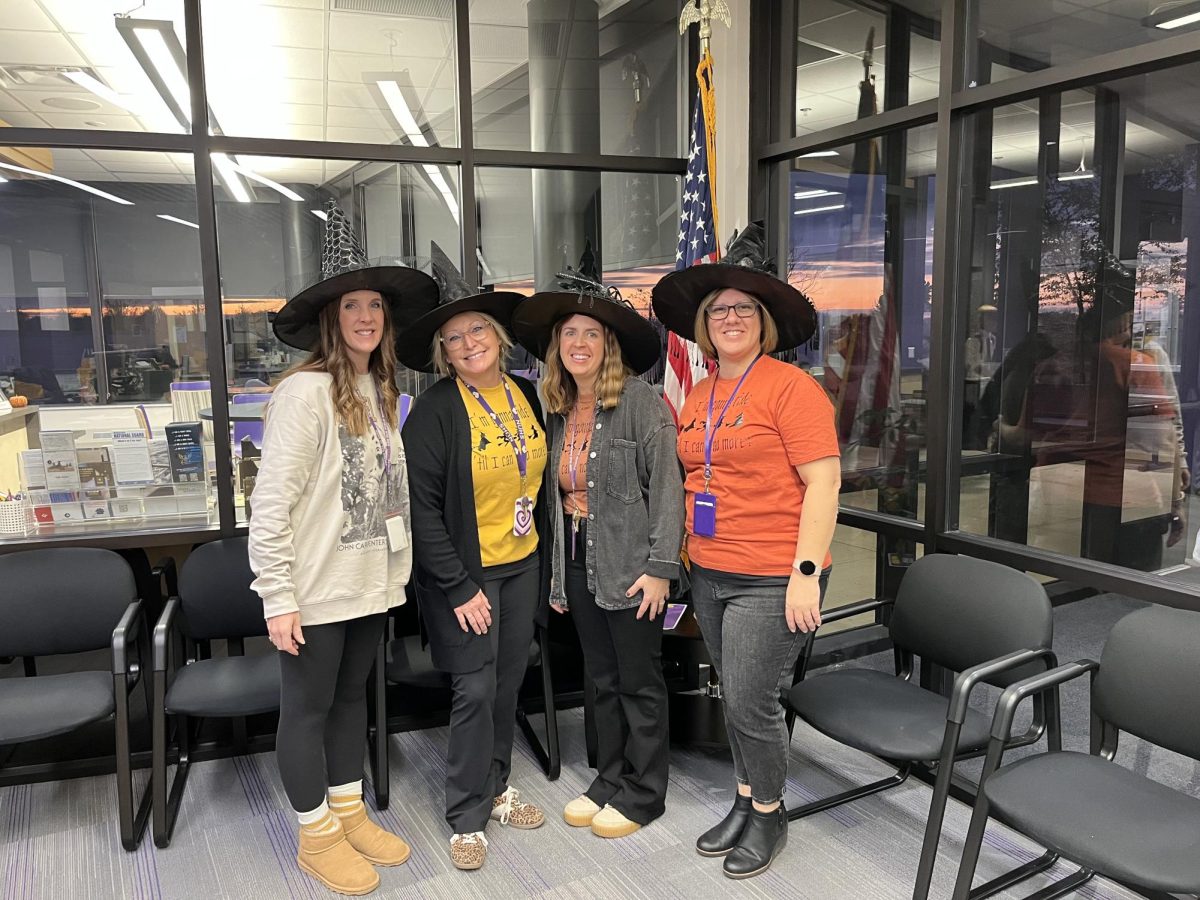 Office ladies dressed as matching witches