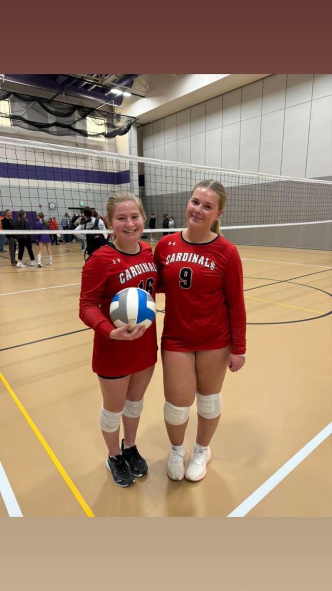 Caithlynn (#9) and a friend during volleyball.