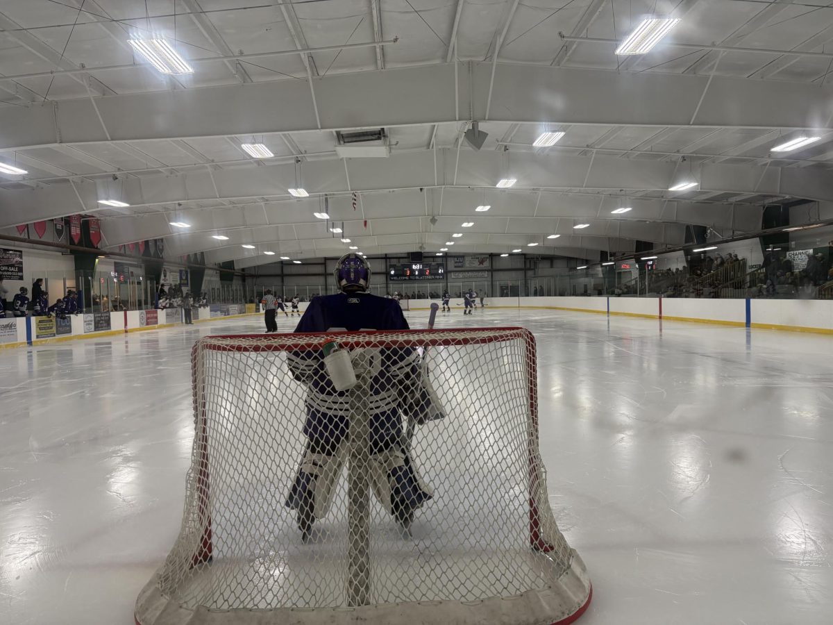 Blaine Arneson in net watching the play in other zone