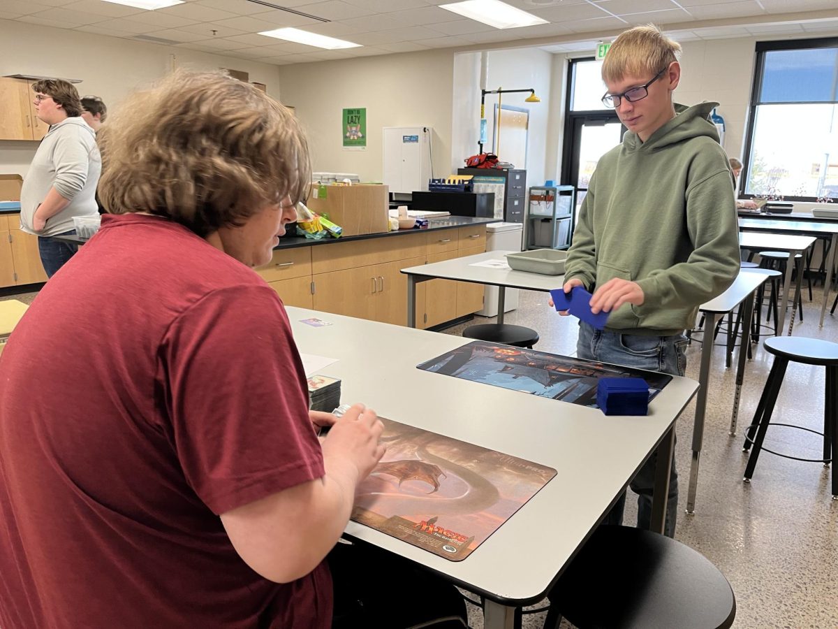 Michael Fitterer and Chase Larson setting up a game of Magic