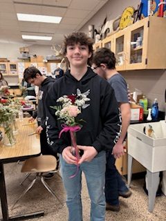 Junior Jett Volk with his floral arrangement.