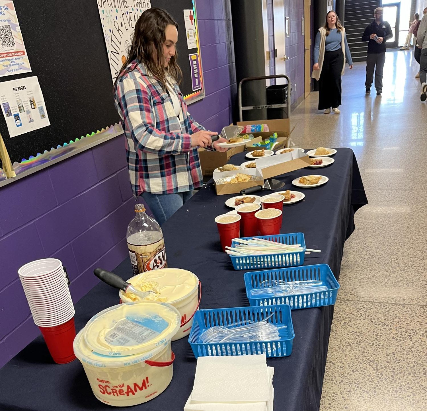 Zelli Kamm serving pie at the staff pie social.