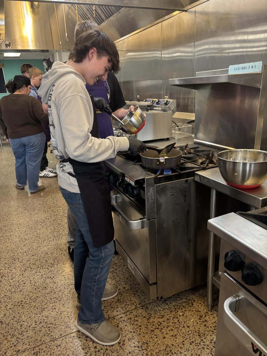 Junior Jett Volk watching his hash browns to make sure they don't burn. 