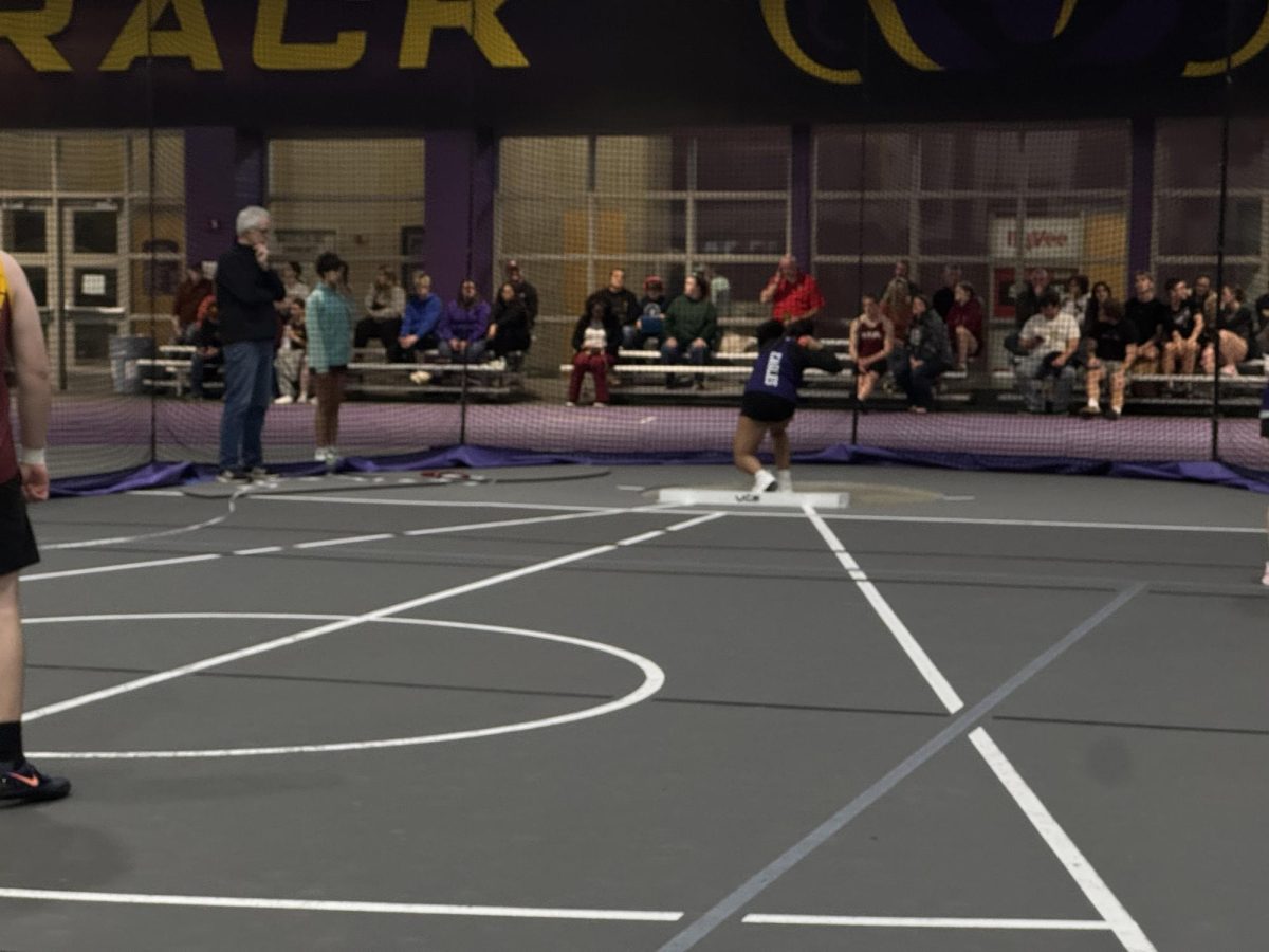Brielle Evens throwing shot put