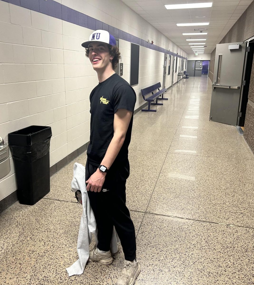 NUHS senior Kyle Albrecht rocks New Ulm Current merch during school
