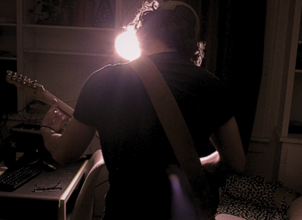 Addison Olson playing guitar
