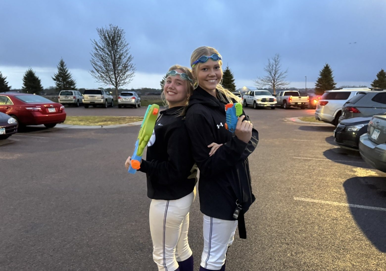 Lauren and Maddi pose for a picture with their goggles and water guns.