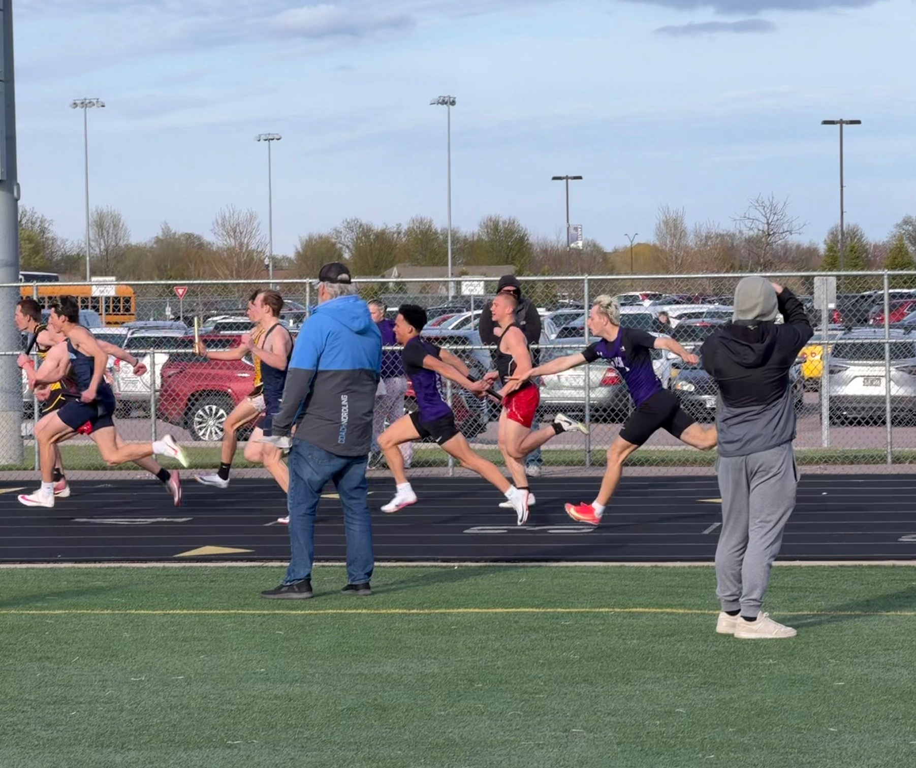 Hunter Heil handing the baton off to Jamison Portner
