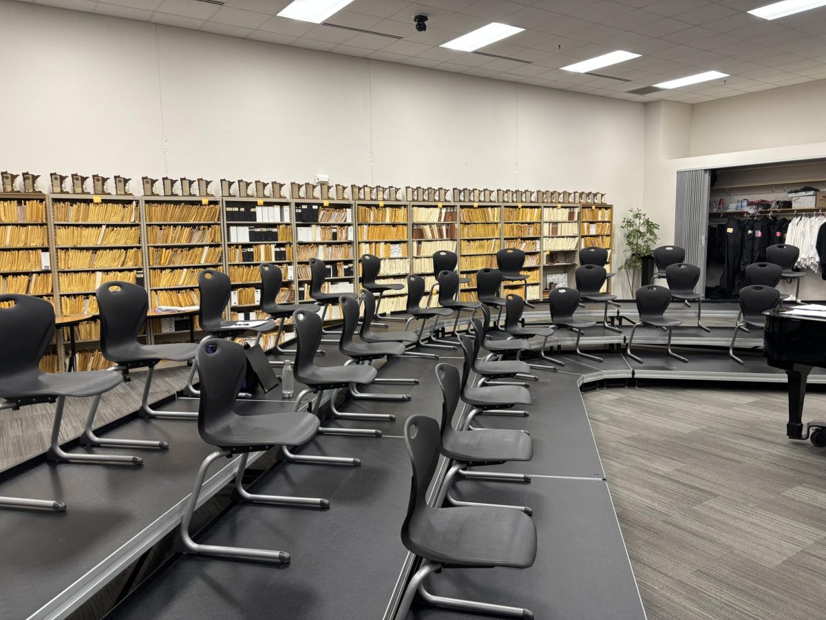 The empty choir room with the lasting trophies in the back.