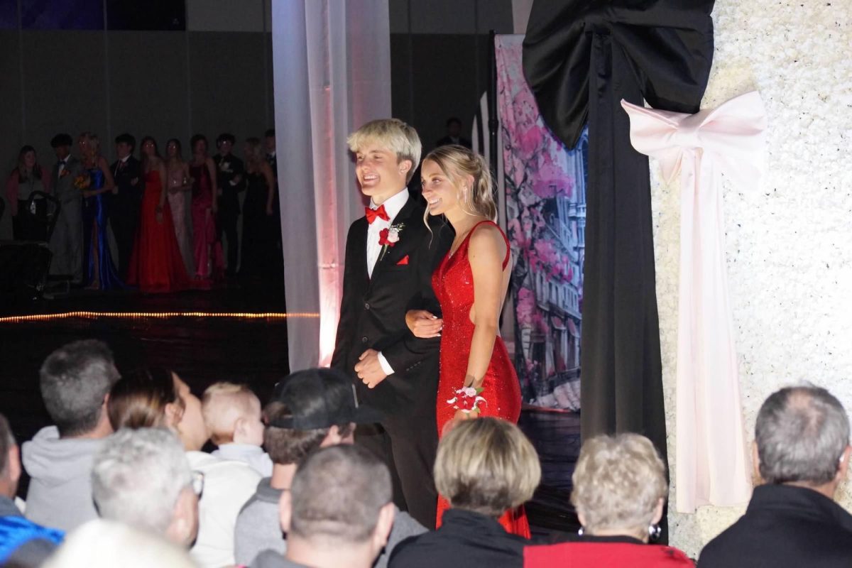Senior Dirk Haynes and Junior Calli Koop walk Grand March 