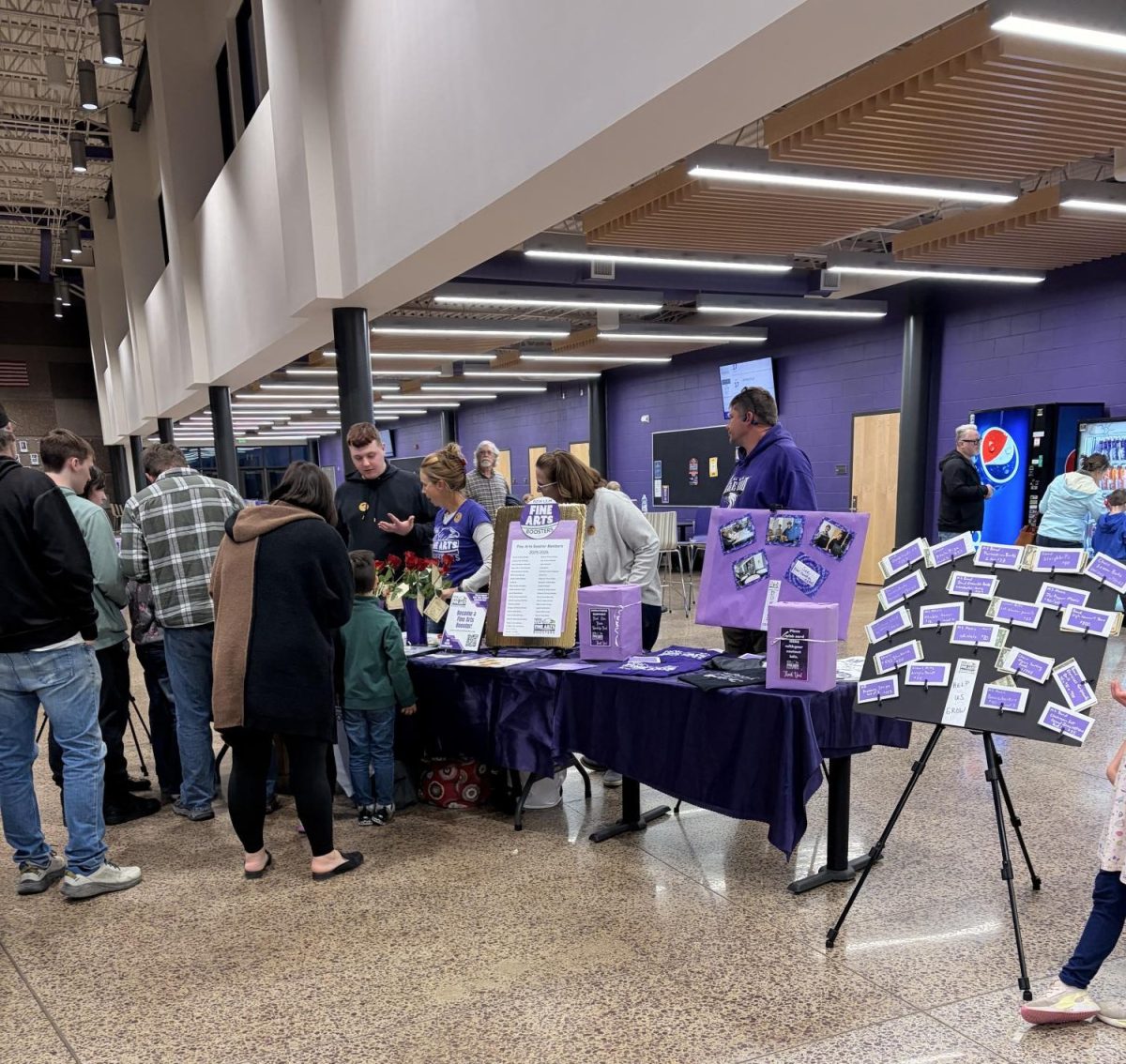 Fine arts booster club stand at intermission. 