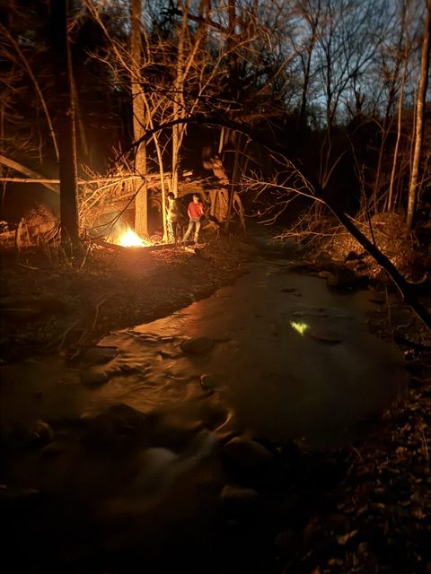 Graduated Senior Carson Dulas (left) and Logan Platz enjoying a campfire in a deep creek. 