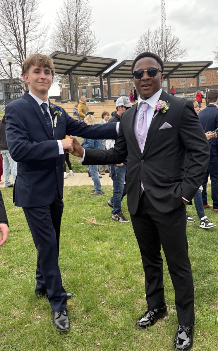 Senior Kolt Peterson dapping up Junior Methodius Amoah at German park