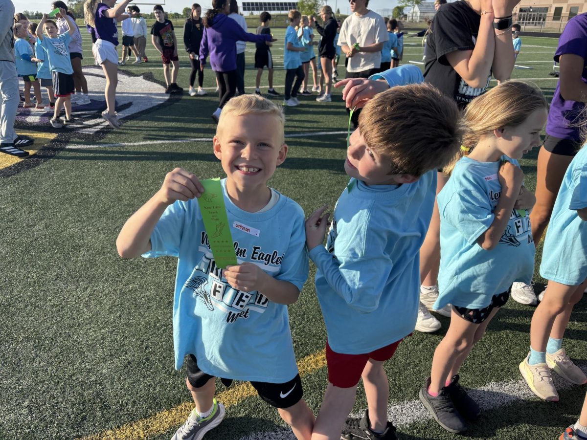 Greyson and his friend show off their ribbons after the eaglet