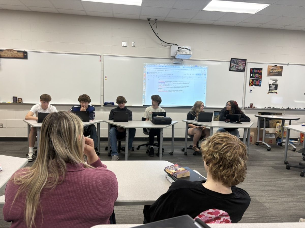 Students that are running for vice president in American government participate in a class debate